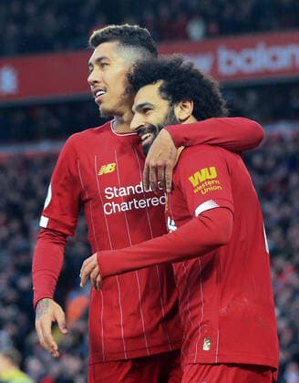 1st February 2020; Anfield, Liverpool, Merseyside, England; English Premier League Football, Liverpool versus Southampton; Mohammed Salah of Liverpool celebrates with team mate Roberto Firmino after scoring his side s third goal - Strictly Editorial Use Only. No use with unauthorized audio, video, data, fixture lists, club league logos or live services. Online in-match use limited to 120 images, no video emulation. No use in betting, games or single club league player publications  ActionPlus12208634 DavidxBlunsden