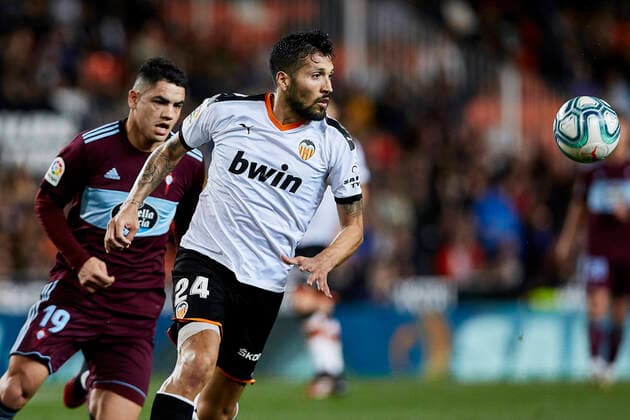 1st February 2020; Mestalla, Valencia, Spain; La Liga Football,Valencia versus Celta Vigo; Ezequiel Garay of Valencia CF follows the ball challenged by Gabriel Fernandez of Celta  ActionPlus12208890 IvanxArlandis