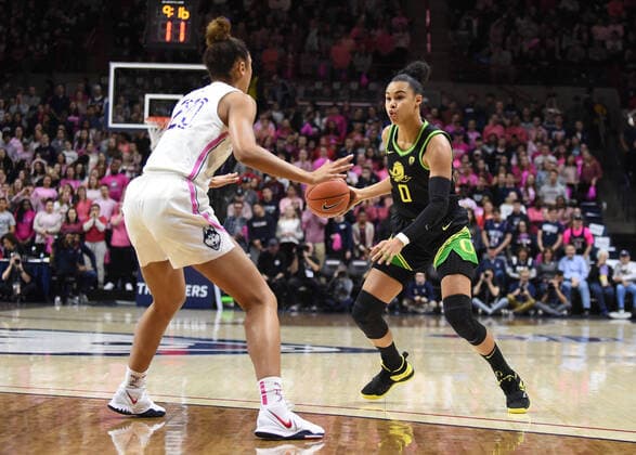 STORRS, CT - FEBRUARY 03: Oregon Ducks forward Satou Sabally (0) handles the ball while defended by UConn Huskies forward Olivia Nelson-Ododa (20) during the game as the Oregon Ducks take on the UConn Huskies on February 3, 2020, at Gampel Pavilion in Storrs, Connecticut. (Photo by Williams Paul Icon Sportswire) COLLEGE BASKETBALL: FEB 03 Women s Oregon at UConn Icon2002037764