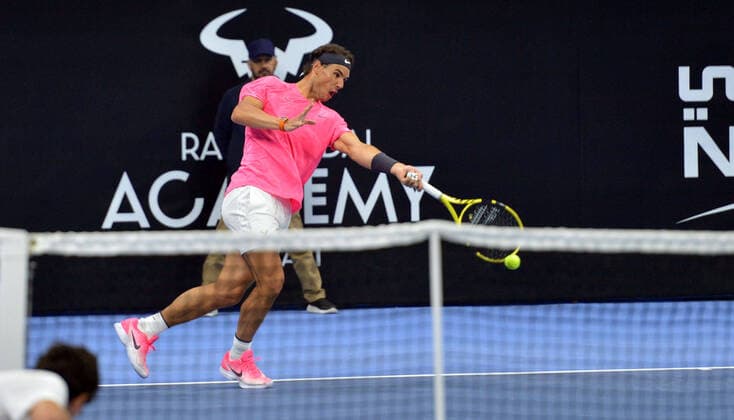 (200206) -- KUWAIT, Feb. 6, 2020 -- Rafael Nadal hits a return during an exhibition match between Rafael Nadal and David Ferrer at the opening ceremony of Rafa Nadal Academy in Hawalli Governorate, Kuwait, on Feb. 5, 2020. (Photo by Asad Xinhua) (SP)KUWAIT-HAWALLI GOVERNORATE-RAFA NADAL ACADEMY-OPENING NiexYunpeng 