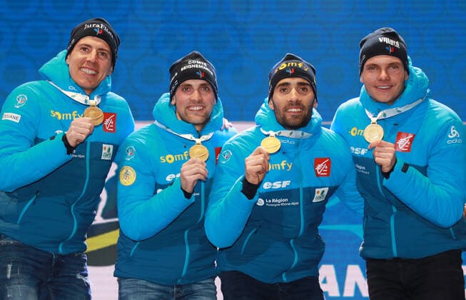 BIATHLON - IBU World Championships Antholz 2020 ANTHOLZ,ITALY,22.FEB.20 - BIATHLON - IBU World Championships 2020, 4x7.5km relay, men, award ceremony. Image shows the rejoicing of Simon Desthieux, Emilien Jacquelin, Martin Fourcade and Quentin Fillon Maillet (FRA). Keywords: medal. GEPAxpictures xAndreasxPranter