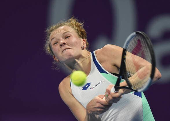 (200224) -- DOHA, Feb. 24, 2020 (Xinhua) -- Katerina Siniakova of the Czech Republic hits a return to Ons Jabeur of Tunisia during their women s singels first round match at 2020 WTA, Tennis Damen Qatar Open tennis tournament in Doha, Qatar, Feb. 23, 2020. (Photo by Nikku Xinhua) (SP)QATAR-DOHA-TENNIS-WTA-SINGLES 
