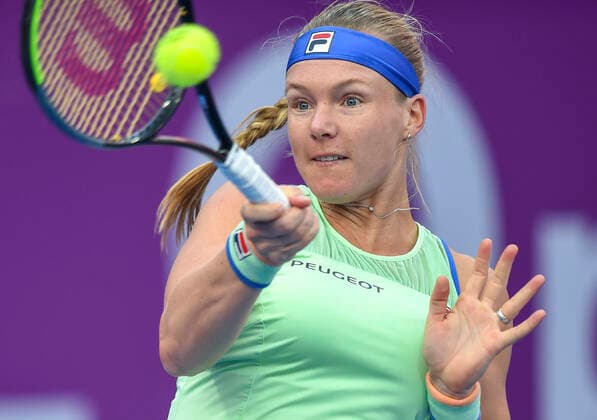 (200227) -- DOHA, Feb. 27, 2020 (Xinhua) -- Kiki Bertens of the Netherlands hits a return during the women s singles third round match against Zheng Saisai of China at the 2020 WTA, Tennis Damen Qatar Open in Doha, Qatar, Feb. 26, 2020. (Photo by Nikku Xinhua) (SP)QATAR-DOHA-TENNIS-WTA-SINGLES 