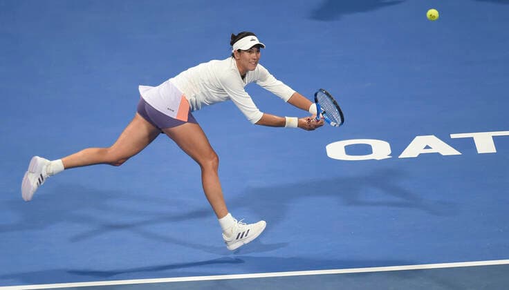 (200227) -- DOHA, Feb. 27, 2020 (Xinhua) -- Garbine Muguruza of Spain hits a return during the women s singles third round match against Dayana Yastremska of Ukraine at the 2020 WTA, Tennis Damen Qatar Open in Doha, Qatar, Feb. 26, 2020. (Photo by Nikku Xinhua) (SP)QATAR-DOHA-TENNIS-WTA-SINGLES 