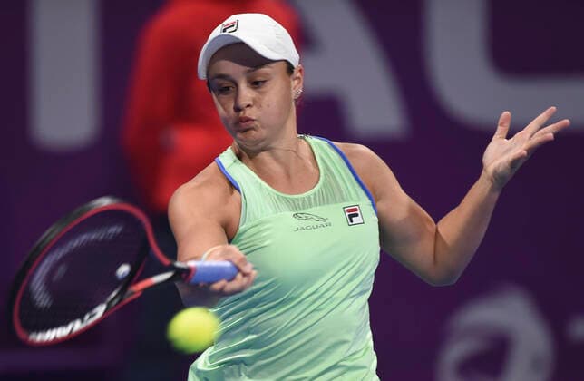 (200228) -- DOHA, Feb. 28, 2020 (Xinhua) -- Ashleigh Barty of Australia hits a return during the women s singles quarterfinal match against Garbine Muguruza of Spain at the 2020 WTA, Tennis Damen Qatar Open in Doha, Qatar, Feb. 27, 2020. (Photo by Nikku Xinhua) (SP)QATAR-DOHA-TENNIS-WTA-SINGLES 