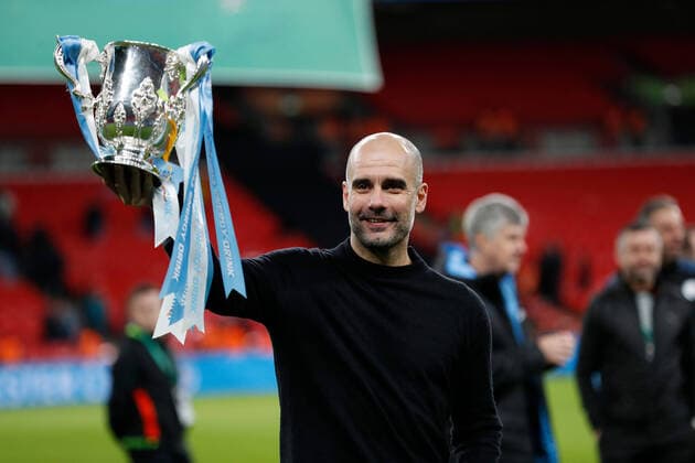 1st March 2020; Wembley Stadium, London, England; Carabao Cup Final, League Cup, Aston Villa versus Manchester City; Manchester City Manager Pep Guardiola celebrating while lifting the EFL Cup in front of the Manchester City fans  ActionPlus12215141 JohnxPatrickxFletcher