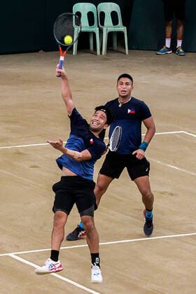 (200307) -- MANILA, March 7, 2020 -- Francis Casey Alcantara (R) and Ruben Gonzalez of the Philippines compete against Markos Kalovelonis and Petros Tsitsipas of Greece during the Davis Cup World Group II Play-Offs First Round doubles match between the Philippines and Greece in Manila, the Philippines on March 7, 2020. ) (SP)PHILIPPINES-MANILA-TENNIS-DAVIS CUP-GREECE VS PHILIPPINES ROUELLExUMALI 