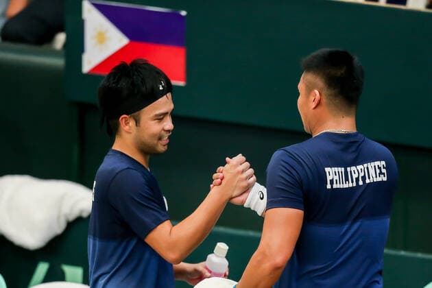(200307) -- MANILA, March 7, 2020 -- Francis Casey Alcantara (R) and Ruben Gonzalez of the Philippines celebrate after winning Markos Kalovelonis and Petros Tsitsipas of Greece during the Davis Cup World Group II Play-Offs First Round doubles match between the Philippines and Greece in Manila, the Philippines on March 7, 2020. ) (SP)PHILIPPINES-MANILA-TENNIS-DAVIS CUP-GREECE VS PHILIPPINES ROUELLExUMALI 