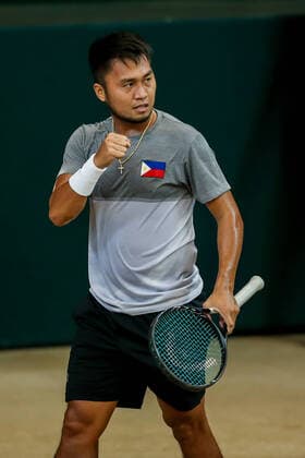 (200307) -- MANILA, March 7, 2020 -- Jeson Patrombon of the Philippines competes against Stefanos Tsitsipas of Greece during the Davis Cup World Group II Play-Offs First Round doubles match between the Philippines and Greece in Manila, the Philippines on March 7, 2020. ) (SP)PHILIPPINES-MANILA-TENNIS-DAVIS CUP-GREECE VS PHILIPPINES ROUELLExUMALI 