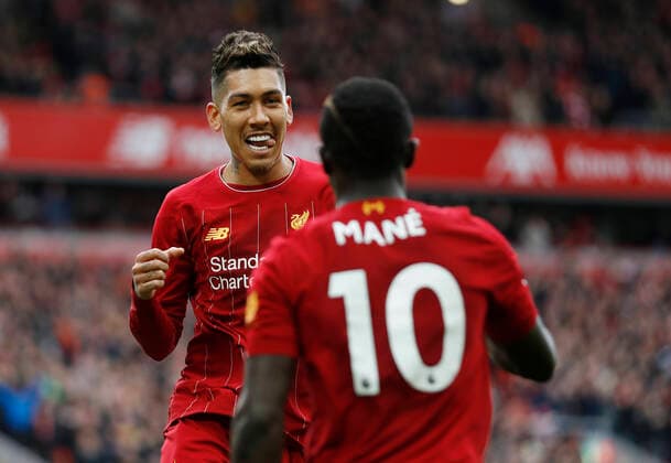 Roberto Firmino of Liverpool celebrates with scorer Sadio Mane of Liverpool during the Premier League match at Anfield, Liverpool. Picture date: 7th March 2020. Picture credit should read: Darren Staples Sportimage EDITORIAL USE ONLY. No use with unauthorised audio, video, data, fixture lists, club league logos or live services. Online in-match use limited to 120 images, no video emulation. No use in betting, games or single club league player publications. SPI-0534-0029