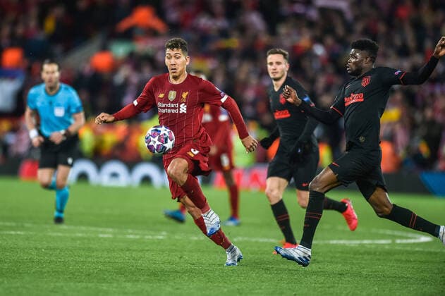Liverpool v Atletico Madrid UEFA Champions League Roberto Firmino of Liverpool and Thomas Partey of Atletico Madrid chase a loose ball during the UEFA Champions League match at Anfield, Liverpool Content Not Available For UK Newspapers Copyright: xMattxWilkinsonx FIL-14217-0055