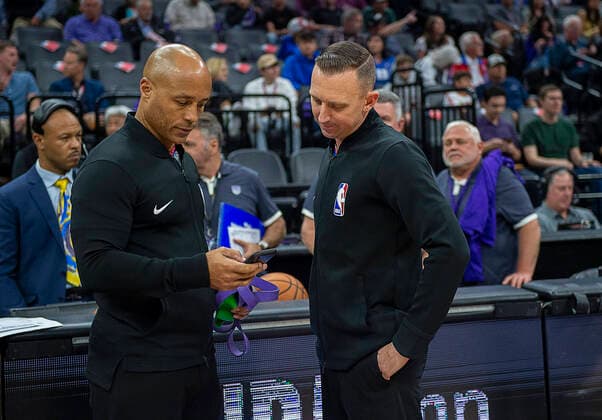 March 11, 2020, Sacramento, CA, USA: NBA, Basketball Herren, USA officials Marc Davis and Justin Van Duyne confer at Golden 1 Center on Wednesday, March 11, 2020 in Sacramento as the NBA suspends season after JazzÃ¢â‚¬â ¢s Rudy Gobert tests positive for coronavirus. Sacramento USA - ZUMAj89_ 20200311_zaf_j89_031 Copyright: xPaulxKitagakixJr.x