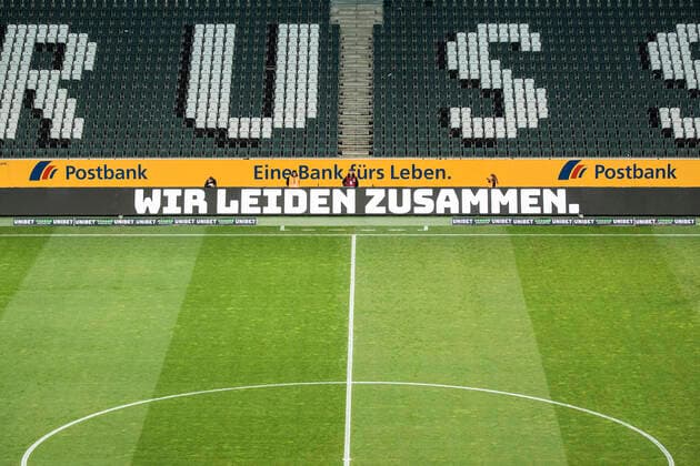 Mönchengladbach, Germany, Borussiapark, 11.03.2020: Wir leiden zusammen in front of an empty stadium with empty places during the Bundesliga match Borussia Mönchengladbach vs. 1.FC Köln in the season 2019 2020 (Geisterspiel, ghost game, coronavirus) DFL regulations prohibit any use of photographs as image sequences and or quasi-video.