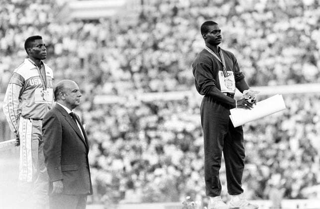 870830 Athletics, World Athletics Championships: Winner Ben Johnson, Canada, and 2nd placed Carl Lewis, USA, react on the podium after the 100 m final at The World Athletics Championships on August 30, 1987 in Rome, Italy. BILDBYRAN *** 870830 Athletics, World Athletics Championships Winner Ben Johnson, Canada, and 2nd placed Carl Lewis, USA, react on the podium after the 100 m final at The World Athletics Championships on August 30, 1987 in Rome, Italy BILDBYRAN,  Copyright: BILDBYRAN 870830019