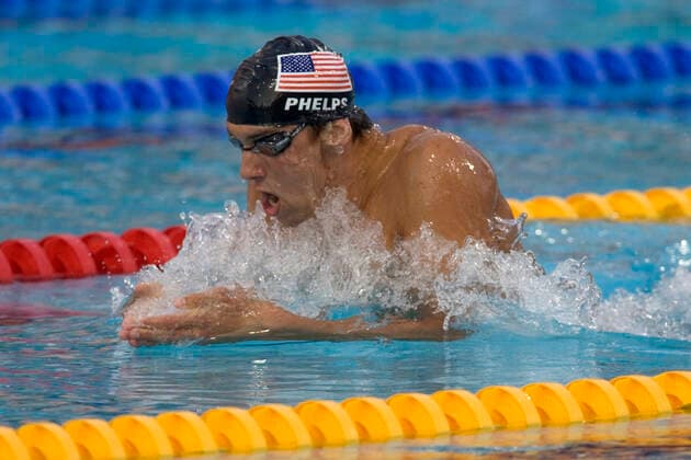 Swimming Michael Phelps (USA) in the breaststroke portions of the 400m IM where he won the Gold medal and also broke his own world record_2004 Olympic Summer Games, Athens, Greece. August 14, 2004. Athens Greece Copyright: xPaulxJxSutton PCNx SW1217 106079