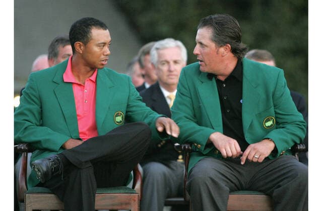 Golf: Phil Mickelson Phil Mickelson (R) chats with Tiger Woods after winning the Masters Tournament in Augusta, Georgia, on April 9, 2006. 
