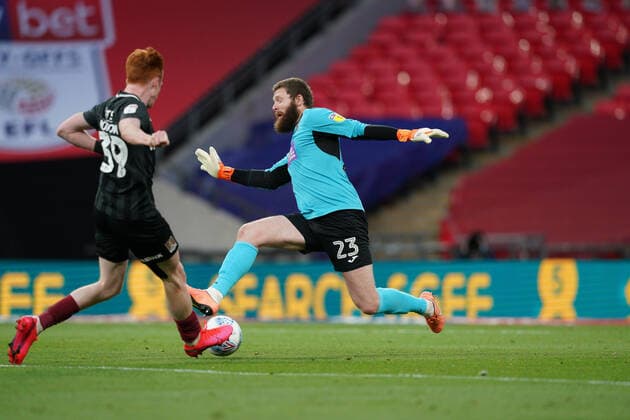 Goalkeeper Jonathan Maxted of Exeter City does enough to put off Callum Morton (on loan from WBA) of Northampton Town during the Sky Bet League 2 PLAY-OFF Final match between Exeter City and Northampton Town at Wembley Stadium, London, England on 29 June 2020. Copyright: xAndyxRowlandx PMI-3511-0099