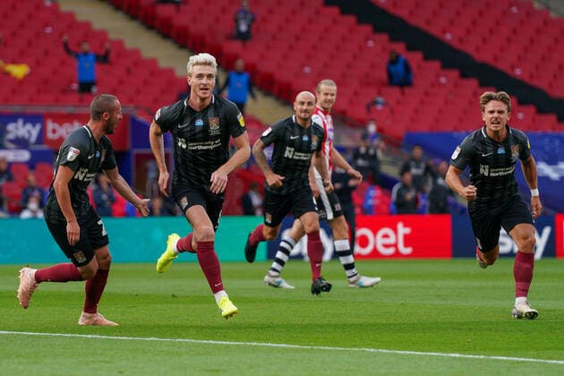 Ryan Watson of Northampton Town (2nd left) celebrates with Michael Harriman of Northampton Town (left) and Sam Hoskins of Northampton Town (right) after he scores the opening goal during the Sky Bet League 2 PLAY-OFF Final match between Exeter City and Northampton Town at Wembley Stadium, London, England on 29 June 2020. Copyright: xAndyxRowlandx PMI-3511-0127