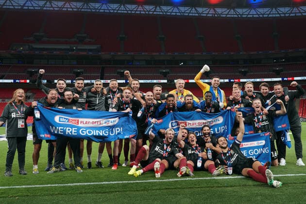 Northampton Town players and staff celebrate promotion to League One after a 4-0 victory in the Sky Bet League 2 PLAY-OFF Final match between Exeter City and Northampton Town at Wembley Stadium, London, England on 29 June 2020. Copyright: xAndyxRowlandx PMI-3511-0134