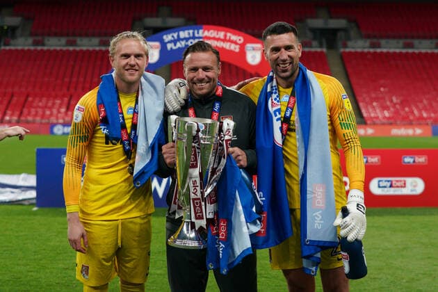 Goalkeeper David Cornell of Northampton Town and Goalkeeper Steve Arnold of Northampton Town (right) celebrate promotion to League One with the trophy after a 4-0 victory in the Sky Bet League 2 PLAY-OFF Final match between Exeter City and Northampton Town at Wembley Stadium, London, England on 29 June 2020. Copyright: xAndyxRowlandx PMI-3511-0145