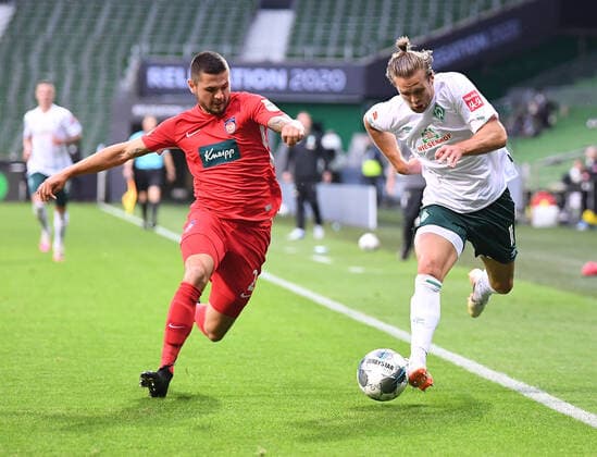 Werder Bremen - 1. FC Heidenheim Fußball, Relegation, Werder Bremen - 1. FC Heidenheim: Zweikampf, Duell Marnon Busch (Heidenheim) gegen Niclas Fuellkrueg (Bremen) r. Photo: Marvin Ibo Güngör GES Pool via xim.gs DFL regulations prohibit any use of photographs as image sequences and or quasi-video. Editorial use only. National and international news agencies out. Bremen Deutschland