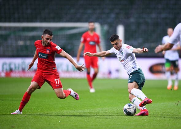 Werder Bremen - 1. FC Heidenheim Fußball, Relegation, Werder Bremen - 1. FC Heidenheim: Zweikampf, Duell Milot Rashica (Bremen) gegen Maurice Multhaup (Heidenheim). Photo: Marvin Ibo Güngör GES Pool via xim.gs DFL regulations prohibit any use of photographs as image sequences and or quasi-video. Editorial use only. National and international news agencies out. Bremen Deutschland