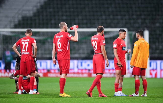 Werder Bremen - 1. FC Heidenheim Fußball, Relegation, Werder Bremen - 1. FC Heidenheim: Nach dem Spiel gehen Konstantin Kerschbaumer (Heidenheim), Patrick Mainka (Heidenheim), Jonas Foehrenbach (Heidenheim) vom Platz. Photo: Marvin Ibo Güngör GES Pool via xim.gs DFL regulations prohibit any use of photographs as image sequences and or quasi-video. Editorial use only. National and international news agencies out. Bremen Deutschland