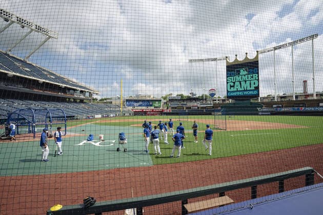 Members of the Kansas City Royals take the field at the start of Summer Camp training at Kaufman Stadium in Kansas City, Missouri on Friday, July 3, 2020. Major League Baseball is finally starting their 2020 season after the COVID-19 pandemic caused months of delays.  KCP20200703109 KYLExRIVAS