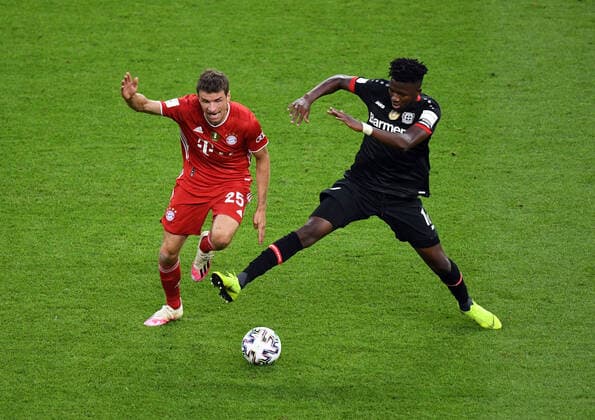 DFB-Pokal-Finale 2020 Bayer 04 Leverkusen - Bayern München v. l. Thomas Mueller (FC Bayern Muenchen), Edmond Tapsoba (Bayer Leverkusen) Fussball, Herren, Saison 2019 2020, 77. Finale um den DFB-Pokal in Berlin, Bayer 04 Leverkusen - FC Bayern München, 04.07. 2020, Foto: Matthias Koch POOL DFL REGULATIONS PROHIBIT ANY USE OF PHOTOGRAPHS as IMAGE SEQUENCES and or QUASI-VIDEO. EDITORIAL USE ONLY. Berlin Olympiastadion Berlin Deutschland