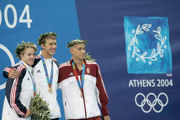 040814 Summer Olympics 2004, Swimming: Gold medalist Michael Phelps of USA is flanked by silver medalist Erik Vendt of USA (L) and bronze medalist Laszlo Cseh of Hungary after 400 m medley at The Summer Olympic Games, Olympische Spiele, Olympia, OS on August 14, 2004 in Athens, Greece. BILDBYRAN  Copyright: LENNARTxMANSSON BB040814LM053