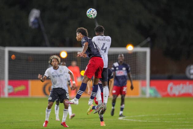 July 25, 2020, Orlando, FL, USA: ORLANDO, FL - JULY 25: Philadelphia Union defender Mark McKenzie (4) and New England Revolution forward Tajon Buchanan (17) go up for a header during the soccer match between the Philadelphia Union and the New England Revolution on July 25, 2020, at ESPN Wide World of Sports Complex in Orlando, FL. ( Icon Sportswire) Orlando USA - ZUMAi88_ 20200725_zaf_i88_194 Copyright: xJoexPetrox