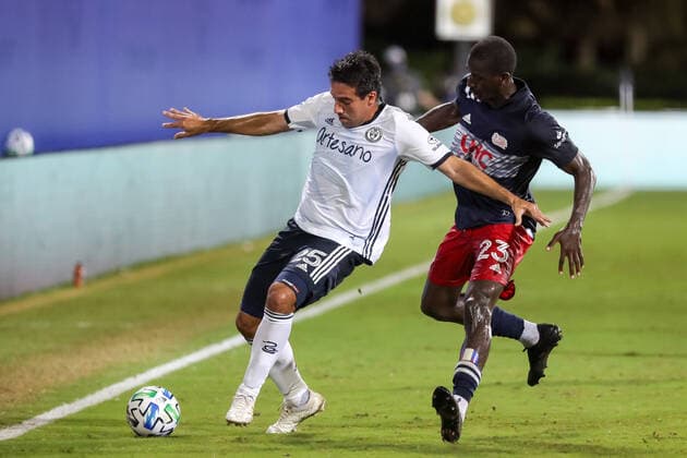 July 26, 2020: Philadelphia Union midfielder ILSINHO (25) competes for the ball against New England Revolution midfielder WILFRIED ZAHIBO (23) during the MLS, Fussball Herren, USA is Back Tournament Philadelphia Union vs New England Revolution match at ESPN Wide World of Sports Complex in Orlando, Fl on July 25, 2020. - ZUMAk149 20200726_zsp_k149_007 Copyright: xCoryxKnowltonx
