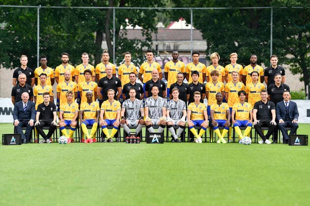 (upper row L-R) physiotherapist Par Vandenborne, Ibrahima Sankhon, Pol Garcia Tena, Christopher Durkin, Samy Mmaee, Wolke Janssens, Jorge Teixeira, Mory Konate, Nelson Balongo, Yuma Suzuki, Siebren Lathouwers, Duckens Nazon, physiotherapist Wouter Robijns, (middle row L-R) warehouseman Valere Stevens, Hamza Massoudi, Steve De Ridder, Keito Nakamura, keeper coach Jurgen De Braekeleer, assistant coach Carlos Perez Salvachua, head coach Kevin Muscat, physical coach Luciano Trani, analyst Yasuaki Osato, Ko Matsubara, Facundo Colidio, Santiago Colombatto, warehouseman Benny Liebens, (lower row L-R) delegate Romain Proesmans, doctor Jonas Massa, Tatsuya Ito, Jhonny Flora Barboza, Mathieu Troonbeeckx, goalkeeper Kenny Steppe, goalkeeper Daniel Yabuki Schmidt, Wim Vanmarsenille, Stan Van Dessel, Samuel Asamoah, Lee Seung-woo, doctor Peter Bollars and team manager Peter Delorge pose for the photographer, in marge of the 2020-2021 photoshoot of Belgian Jupiler Pro League club STVV Sint-Truidense Voetbalvereniging, Monday 27 July 2020 in Sint-Truiden. JOHANxEYCKENS x05830514x