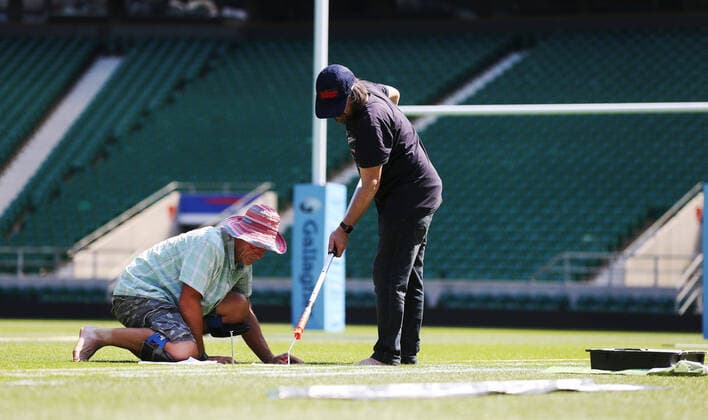 The pitch at Twickenham Stadium has been transformed into a stunning portrait featuring three of Premiership Rugby?s star players today (12th August 2020). The giant rugby art, the largest outdoor painting ever created in the UK, was unveiled to celebrate the restart of Gallagher Premiership Rugby on Friday 14 th August when Harlequins take on Sale Sharks at 7:45pm, just 200 metres away. The artwork features Harlequins player, Joe Marler; Saracens? Maro Itoje, as well as Sale Sharks? Rugby World Cup winner Faf de Klerk. It took team of eight artists more than 24 hours to complete the pitch portrait and more than 100 hours of planning before any paint touched the grass. A bespoke computer program was written to generate the precise measurements that were needed to create the artwork to the exact scale of the stadium. The image, which occupies most of the 7,000 square metre pitch, was created using a grid comprised of 13,420 elements. Each painted line in the portrait is just 6 inches wide. Nearly 1280 litres of biodegradable pitch marker paint were used for the elaborate creation. An estimated 150,000 passengers will enjoy the spectacle from the sky this week on flights in and out of London?s Heathrow airport. Faf de Klerk was one of the featured Premiership Rugby stars in the portrait. The Sale Sharks star said, I didn t realise it was going to be on the field, I thought it was going to be a photo up somewhere or on the big screen. It s looking really cool. There are a lot of great players in the Premiership, and it is amazing. I feel really privileged and quite humble . Speaking about the impact of lockdown on the Saracens star Maro Itoje said The last few months have been really tough on fans and players but we?re back and we?re ready for the start of the season on Friday 14th August. The past five months has shown us how important the sport is and what it brings to people lives. British artist John Lundberg, who oversaw the po Copyright: xScottxGarfitt PinPep CoverxImagesx 0103040129st EDITORIAL USE ONLY. RESTRICTED TO NEWSPAPERS BASED IN THE UK