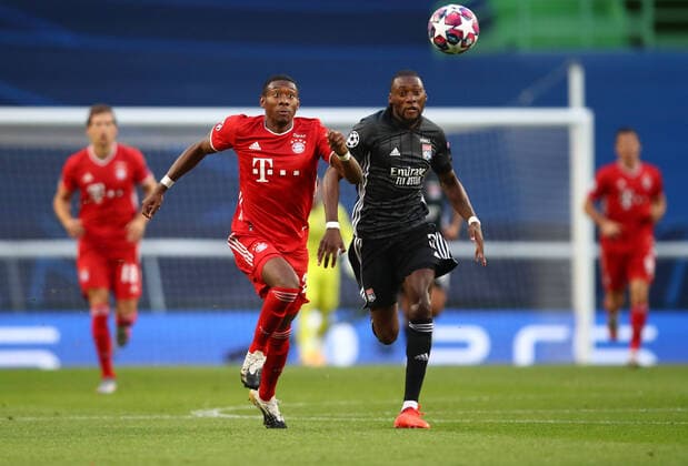 FOOTBALL : Bayern Munich vs Olympique Lyonnais - 1 2 - Phase finale - UEFA Ligue des Champions - Final 8 - Lisbonne - 19 08 2020 LISBON, PORTUGAL - AUGUST 19: David Alaba of Bayern Munich battles for possession with Karl Toko Ekambi of Olympique Lyonnais during the UEFA Champions League Semi Final match between Olympique Lyonnais and Bayern Munich at Estadio Jose Alvalade on August 19, 2020 in Lisbon, Portugal. Lisbonne Portugal