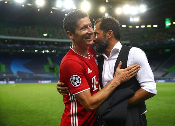 FOOTBALL : Bayern Munich vs Olympique Lyonnais - 1 2 - Phase finale - UEFA Ligue des Champions - Final 8 - Lisbonne - 19 08 2020 LISBON, PORTUGAL - AUGUST 19: Robert Lewandowski of Bayern Munich is embraced following their victory in the UEFA Champions League Semi Final match between Olympique Lyonnais and Bayern Munich at Estadio Jose Alvalade on August 19, 2020 in Lisbon, Portugal. Lisbonne Portugal