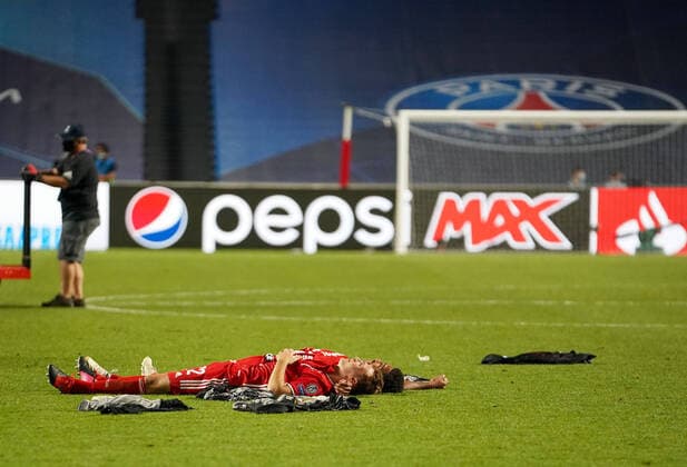 Final Football UEFA Champions League FC BAYERN MUENCHEN - PARIS ST. GERMAIN (PSG) Lisbon, Lissabon, Portugal, 23rd August 2020. Schlussjubel: Joshua Kimmich (Muenchen), Serge Gnabry (Muenchen) liegen auf dem Rasen in the final match UEFA Champions League, final tournament FC BAYERN MUENCHEN - PARIS ST. GERMAIN (PSG) in season 2019 2020, FCB, Photographer: Peter Schatz Pool - UEFA REGULATIONS PROHIBIT ANY USE OF PHOTOGRAPHS as IMAGE SEQUENCES and or QUASI-VIDEO - National and international News-Agencies OUT Editorial Use ONLY Lisbon Estadio da Luz de Benfica Portugal