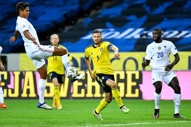 FranceÂ s Raphael Varane, SwedenÂ s Marcus Berg and FranceÂ s Dayot Upamecan oduring the UEFA Nations League football match between Sweden and France at Friends Arena in Stockholm, Sweden September 05, 2020. STOCKHOLM Sweden x10070x