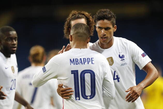 France s Kylian Mbappé is congratulated by Raphael Varane after his goal during the UEFA Nations League football match between Sweden and France at Friends Arena in Stockholm, Sweden September 05, 2020. Stockholm Sweden x10430x
