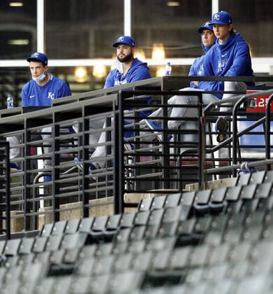 Members of the Kansas City Royals bullpen look on from the Cleveland Indians club seats during their game against the Indians at Progressive Field in Cleveland, Ohio on Monday, September 7, 2020.  CLE20200907111 AARONxJOSEFCZYK