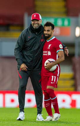 (200913) -- LIVERPOOL, Sept. 13, 2020 -- Liverpool s manager Jurgen Klopp (L) congratulates hat-trick hero Mohamed Salah after the English Premier League match between Liverpool FC and Leeds United FC at Anfield in Liverpool, Britain, Sept. 12, 2020. FOR EDITORIAL USE ONLY. NOT FOR SALE FOR MARKETING OR ADVERTISING CAMPAIGNS. NO USE WITH UNAUTHORIZED AUDIO, VIDEO, DATA, FIXTURE LISTS, CLUB LEAGUE LOGOS OR LIVE SERVICES. ONLINE IN-MATCH USE LIMITED TO 45 IMAGES, NO VIDEO EMULATION. SUN OUT. NO USE IN BETTING, GAMES OR SINGLE CLUB LEAGUE PLAYER PUBLICATIONS. (SP)BRITAIN-LIVERPOOL-FOOTBALL-ENGLISH PREMIER LEAGUE-LIVERPOOL VS LEEDS UNITED HanxYan 