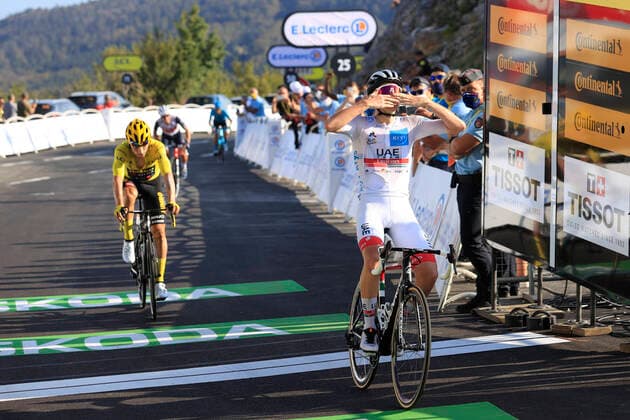 Tadej Pogacar of UAE Team Emirates crosses the finish line to win stage 14 of the 107th edition of the Tour de France cycling race from Lyon to Grand Colombier (174,5 km), in France, Sunday 13 September 2020. This year s Tour de France was postponed due to the worldwide Covid-19 pandemic. The 2020 race starts in Nice on Saturday 29 August and ends on 20 September. POOLxYUZURUxSUNADA  x2542888x
