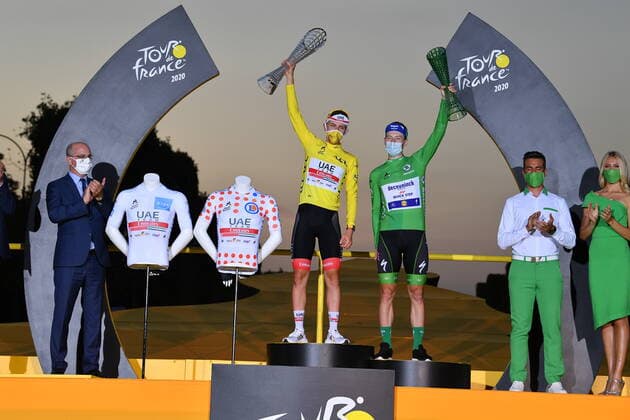 Obveral leader Tadej Pogacar of UAE Team Emirates wearing the yellow jersey and Sam Bennett of Deceuninck - Quick - Step, celebrate on the podium after the final stage of the 107th edition of the Tour de France cycling race, 122km from Mantes-la-Jolie to Paris, in France, Sunday 20 September 2020. This year s Tour de France was postponed due to the worldwide Covid-19 pandemic. The 2020 race starts in Nice on Saturday 29 August and ends on 20 September. DAVIDxSTOCKMAN  x2548274x