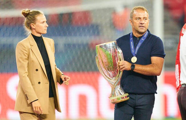 Budapest, Hungary, 24th September 2020. Celebration with trophy Trainer Hansi FLICK (FCB), team manager, headcoach, coach, Kathleen KRUEGER, Teammanager FCB in the Final UEFA Supercup match FC BAYERN MUENCHEN - FC SEVILLA 2-1 in Season 2019 2020, FCB, Munich,