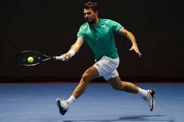 ST PETERSBURG, RUSSIA - OCTOBER 16, 2020: Switzerland s Stan Wawrinka returns the ball in a quarterfinal match against Canada s Denis Shapovalov at the St Petersburg Open 2020 international tournament held at Sibur Arena. Alexander Demianchuk TASS  TS0EB06D