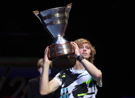 ST PETERSBURG, RUSSIA - OCTOBER 18, 2020: Russia s tennis player Andrei Rublev celebrates with the trophy after winning the final match against Croatia s Coric at the 2020 St Petersburg Open International Tournament at Sibur Arena. Andrei Rublev won the match 6-4, 7-6. Alexander Demianchuk TASS  TS0EB4B1