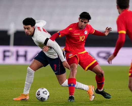 Curtis Jones of England surges past Eric Vales of Andorra during the UEFA EURO, EM, Europameisterschaft,Fussball U21, U 21 Qualifying match at Molineux, Wolverhampton. Picture date: 13th November 2020. Picture credit should read: Andrew Yates Sportimage EDITORIAL USE ONLY. No use with unauthorised audio, video, data, fixture lists, club league logos or live services. Online in-match use limited to 120 images, no video emulation. No use in betting, games or single club league player publications. SPI-0753-0018