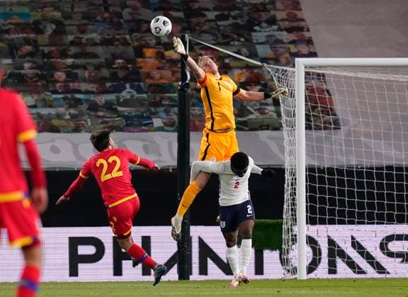 Aaron Ramsdale of England palms the ball away from Albert Rosas Ubach of Andorra during the UEFA EURO, EM, Europameisterschaft,Fussball U21, U 21 Qualifying match at Molineux, Wolverhampton. Picture date: 13th November 2020. Picture credit should read: Andrew Yates Sportimage EDITORIAL USE ONLY. No use with unauthorised audio, video, data, fixture lists, club league logos or live services. Online in-match use limited to 120 images, no video emulation. No use in betting, games or single club league player publications. SPI-0753-0032