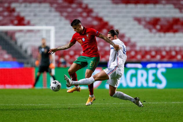 14th November 2020, The Est& xe1;dio da Luz, Lisbon, Portugal; Nations League International football, Portugal versus France; Jo& xe3;o Cancelo of Portugal is tackled by Adrien Rabiot of France  ActionPlus12247194 DiogoxPinto