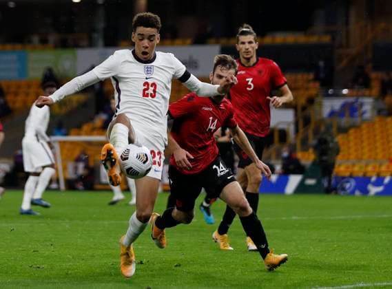 Mario Mitaj of Albania challenges Jamal Musiala of England during the UEFA EURO, EM, Europameisterschaft,Fussball U21, U 21 Qualifying match at Molineux, Wolverhampton. Picture date: 17th November 2020. Picture credit should read: Darren Staples Sportimage EDITORIAL USE ONLY. No use with unauthorised audio, video, data, fixture lists, club league logos or live services. Online in-match use limited to 120 images, no video emulation. No use in betting, games or single club league player publications. SPI-0758-0066